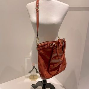Warm peach Coach top handle crossbody bag